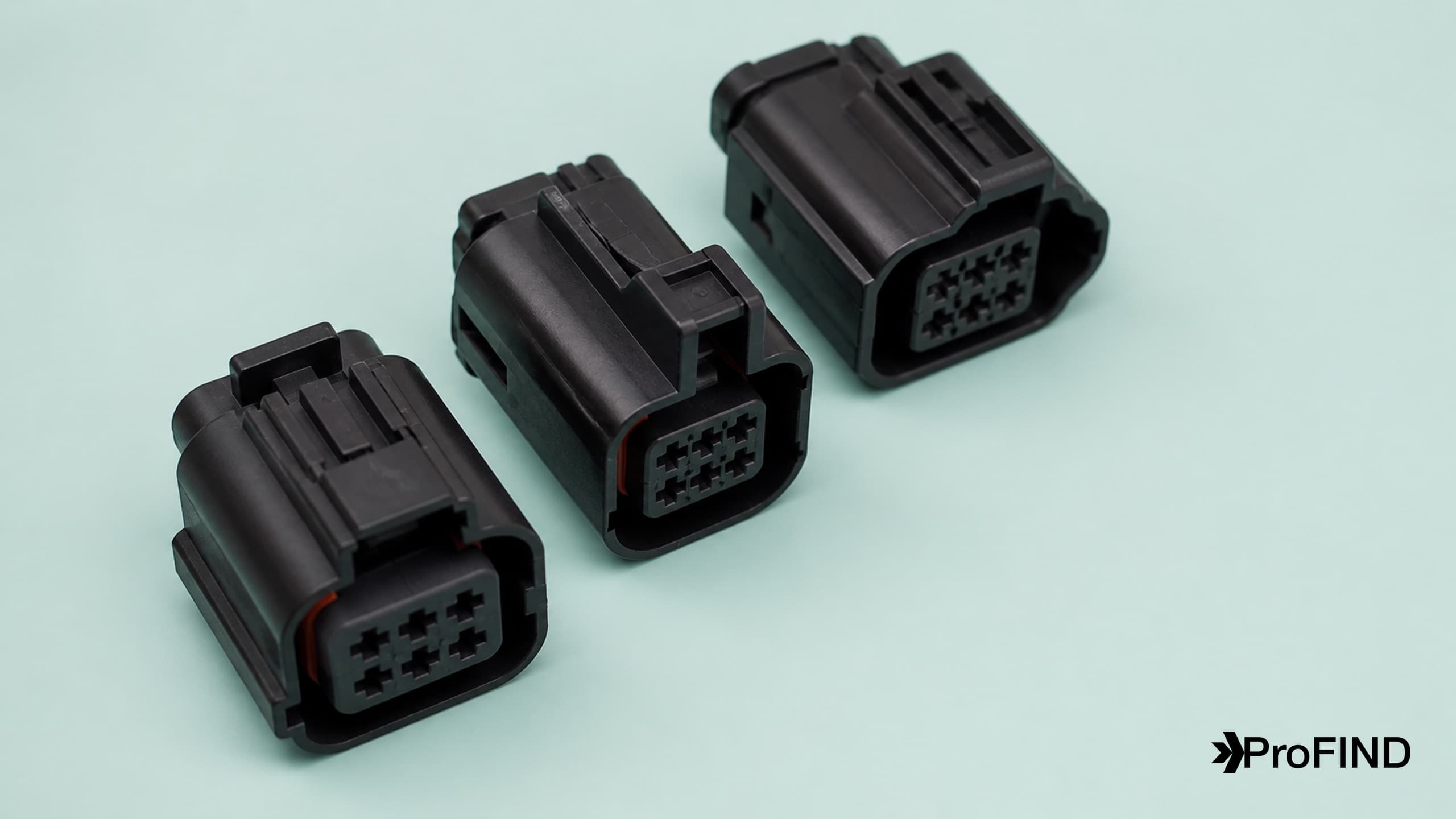 Black connector housings with distinct molded keying features and orange seals